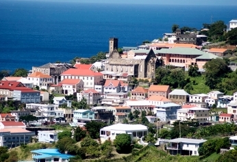 Featured is a photo view of rooftops in St. George's Grenada (West Indies).  Photographer unknown.